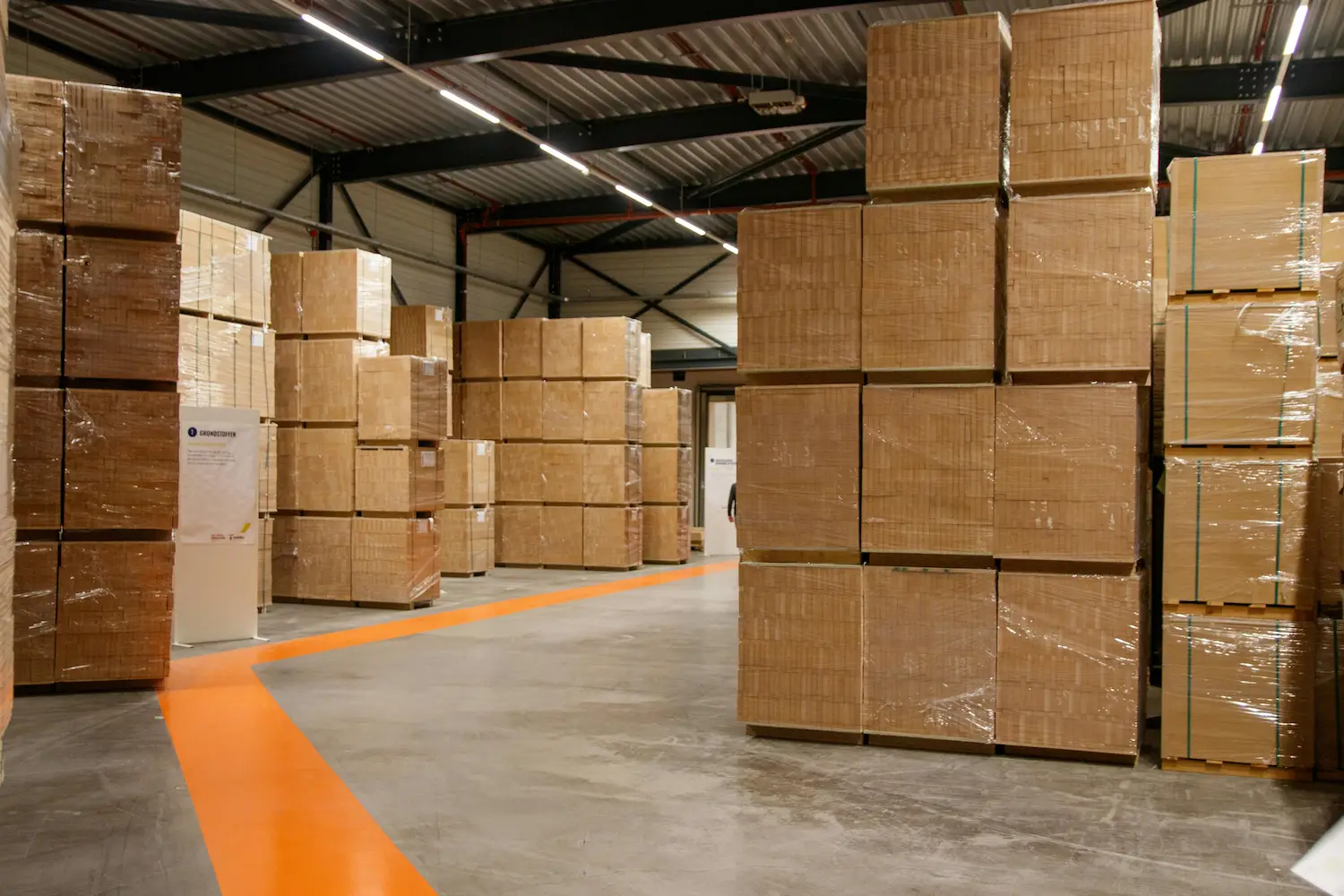 Fulfilment centre with conveyor belts and workers picking orders